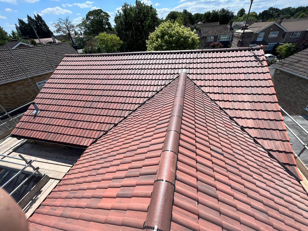 Newly tiled red roof on a UK home